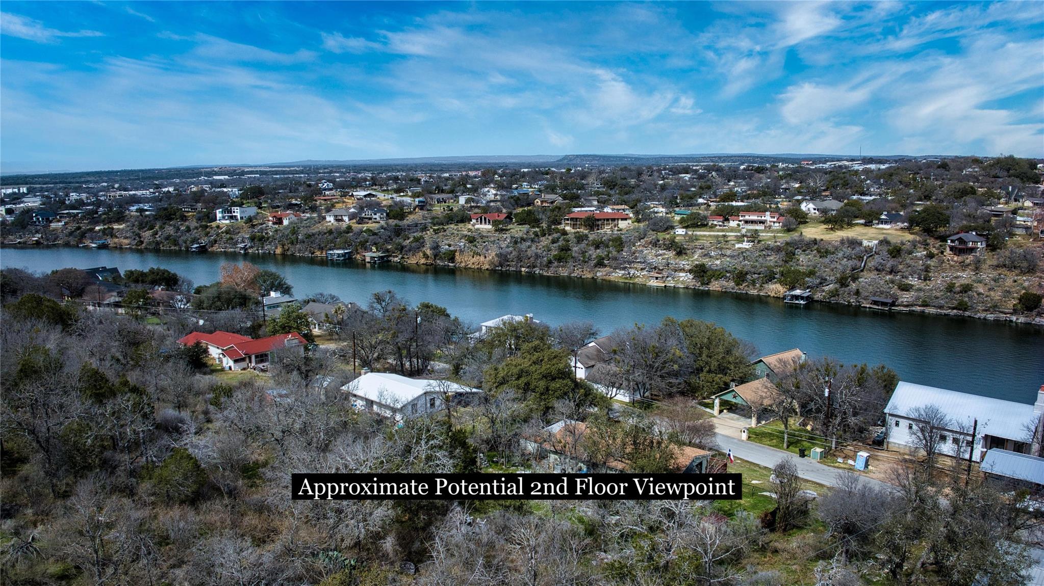 Aerial view of residential area with a nearby bod