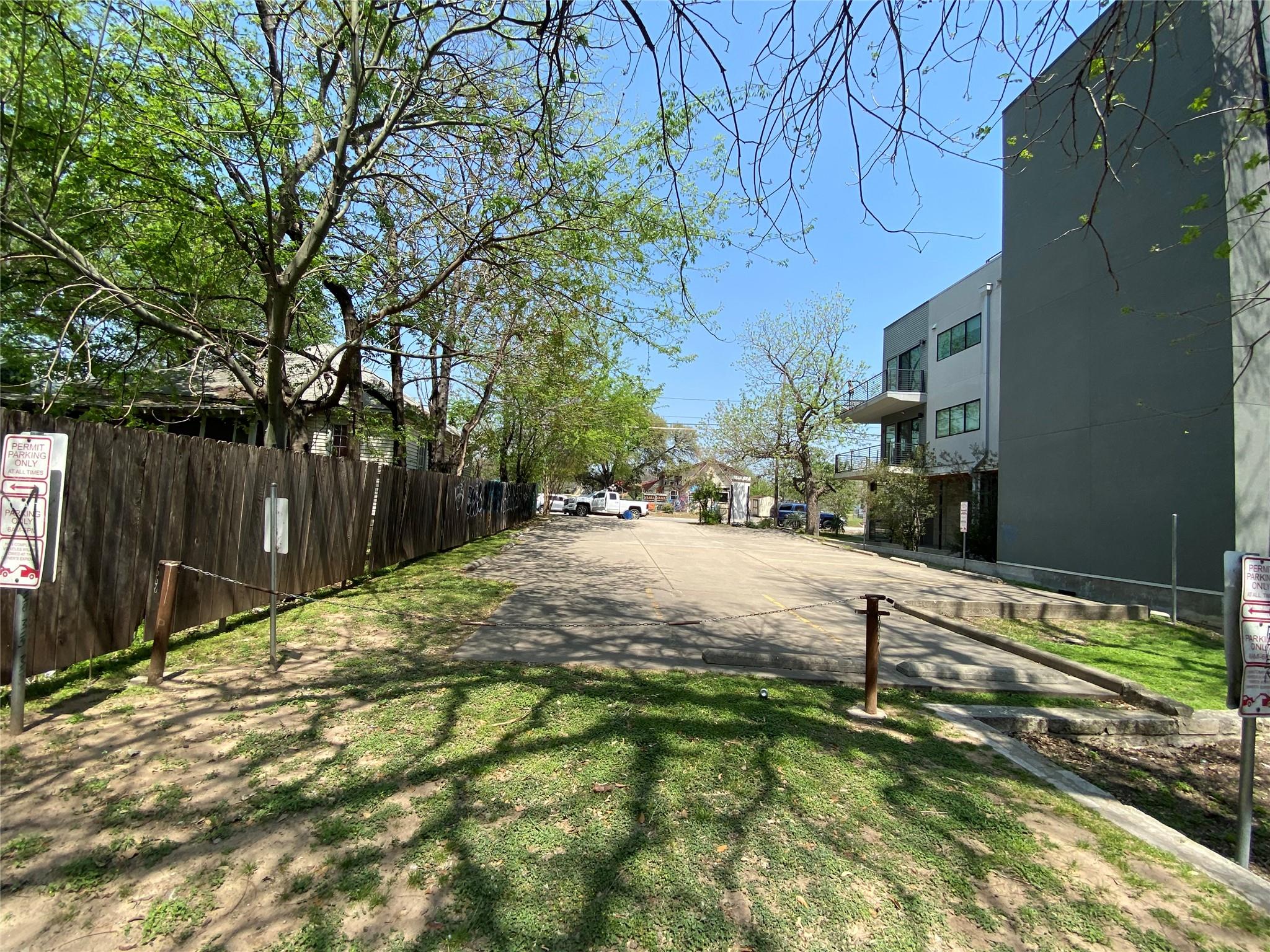View of asphalt street featuring a residential vi