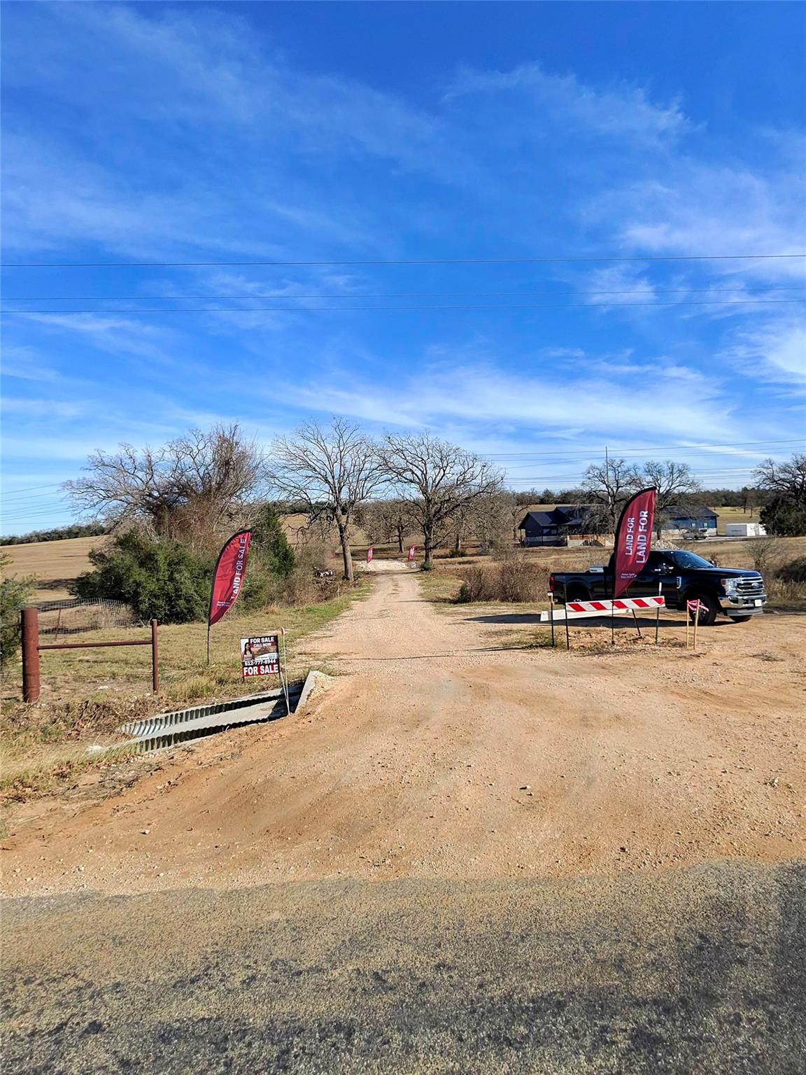 View of dirt / gravel road with a view of rural /