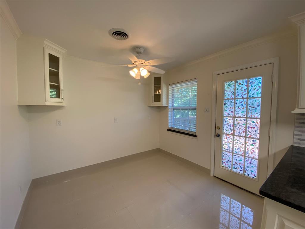 Unfurnished dining area featuring a ceiling fan a