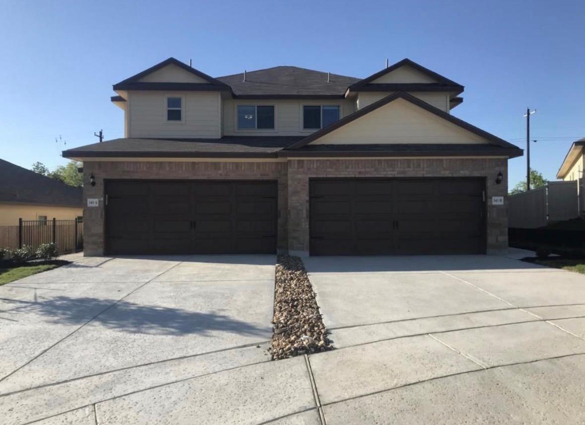 View of front of property featuring driveway