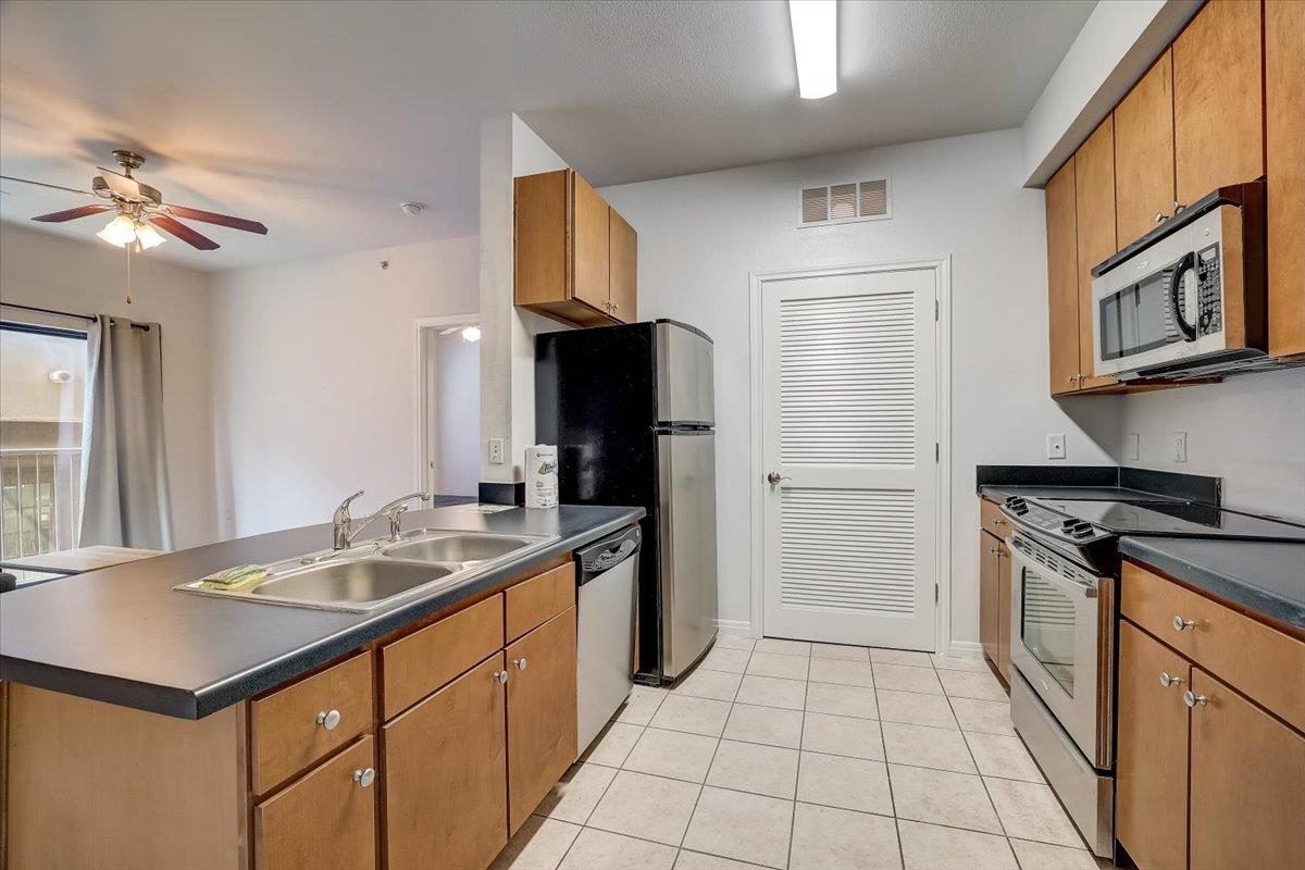 Kitchen featuring appliances with stainless steel