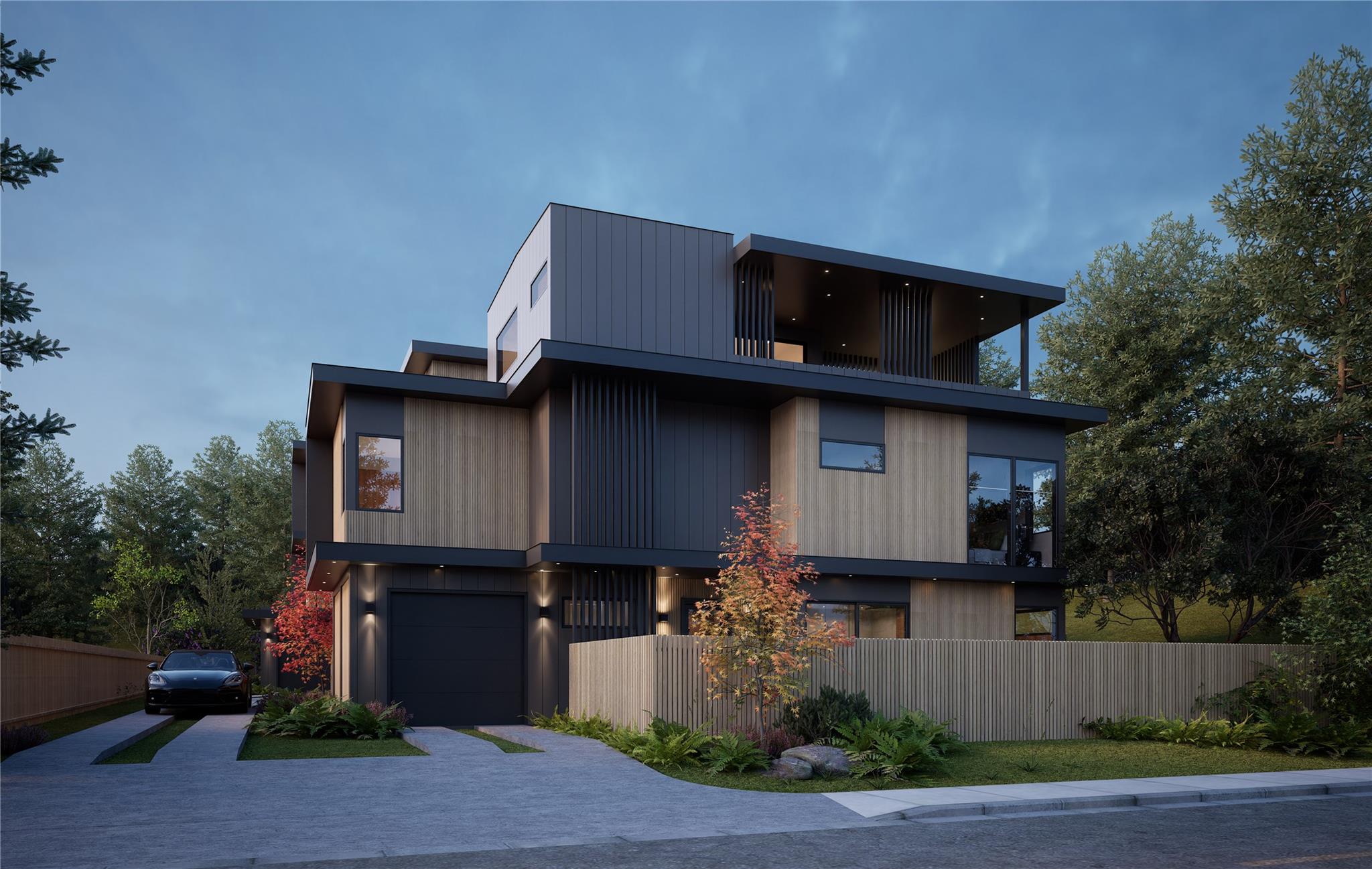 Modern home with driveway and a balcony