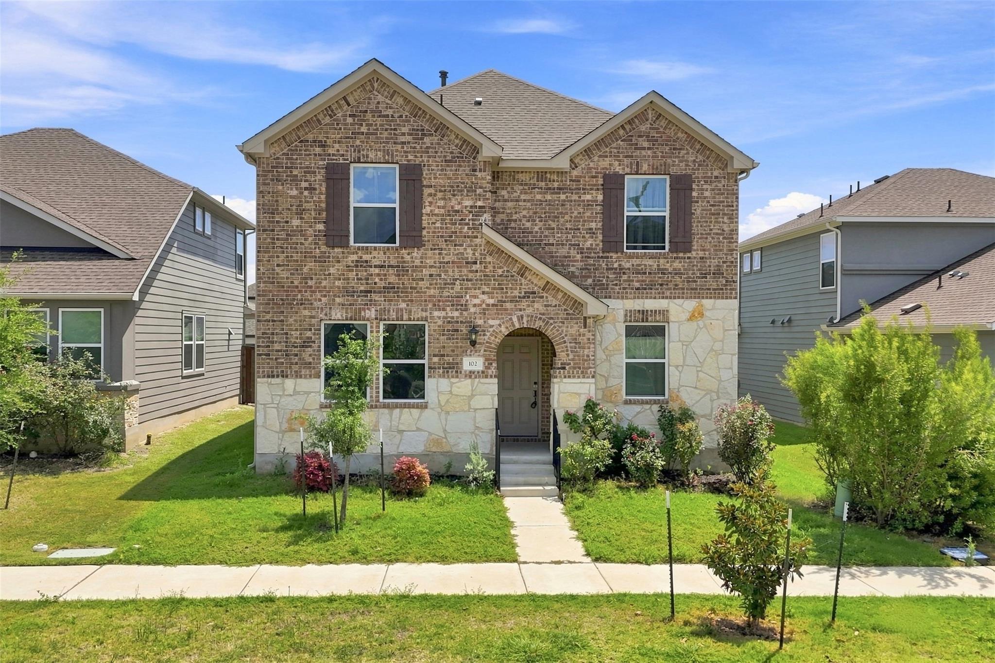 A classic brick and stone facade welcomes you to 