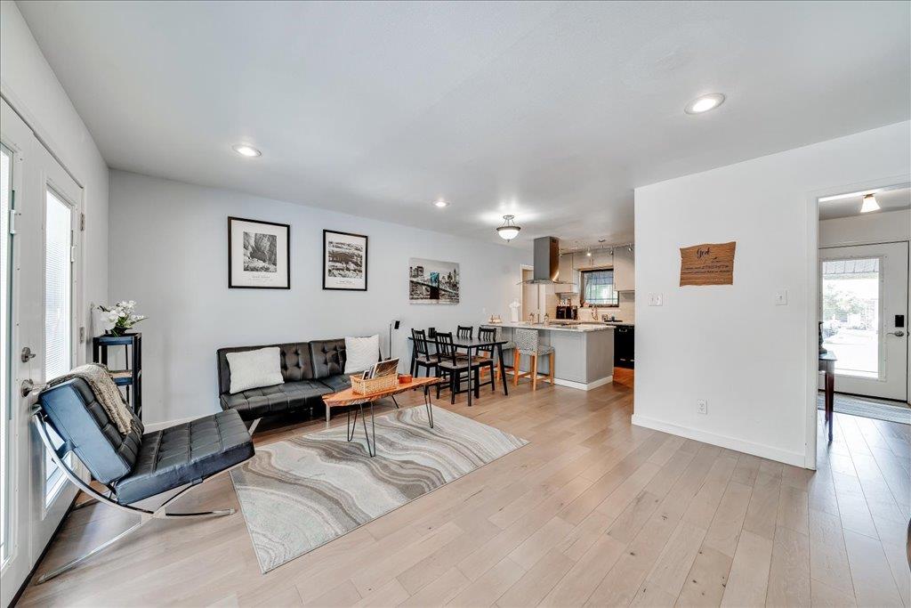 Living area featuring light wood finished floors 