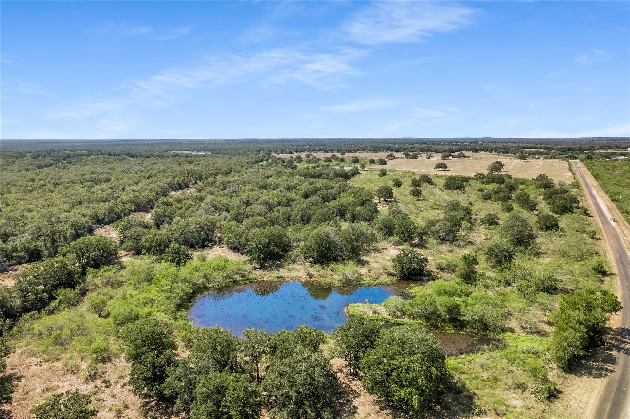Overview of rural landscape featuring a large bod