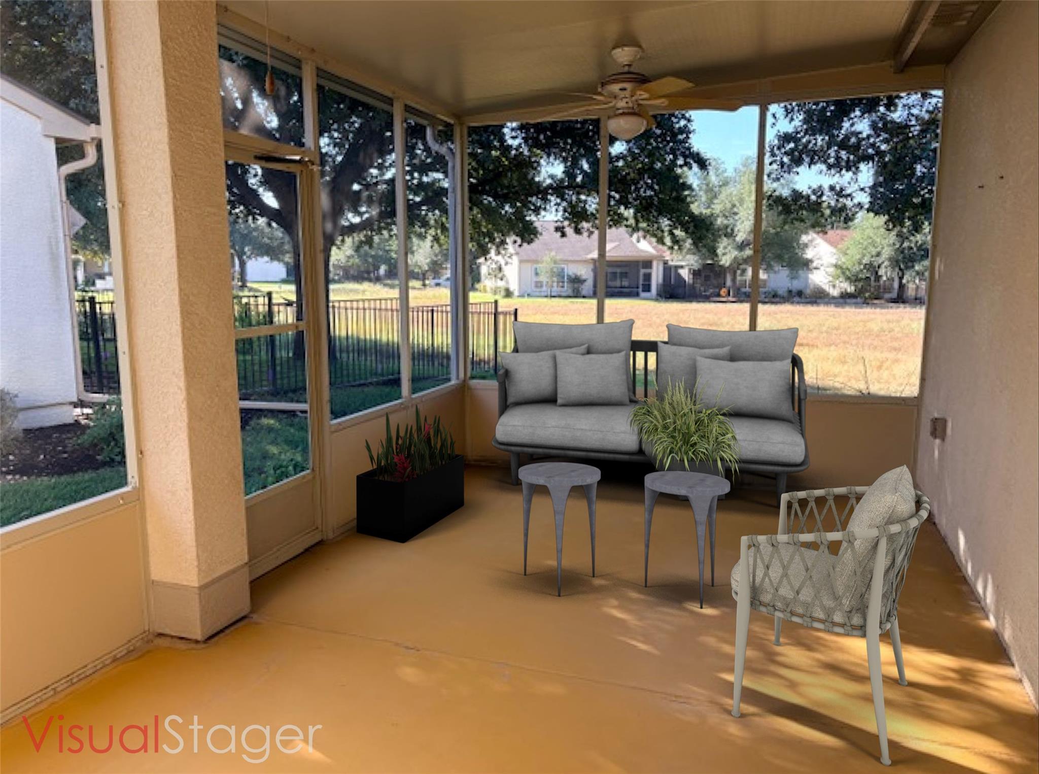Sunroom / solarium with ceiling fan and an outdoo