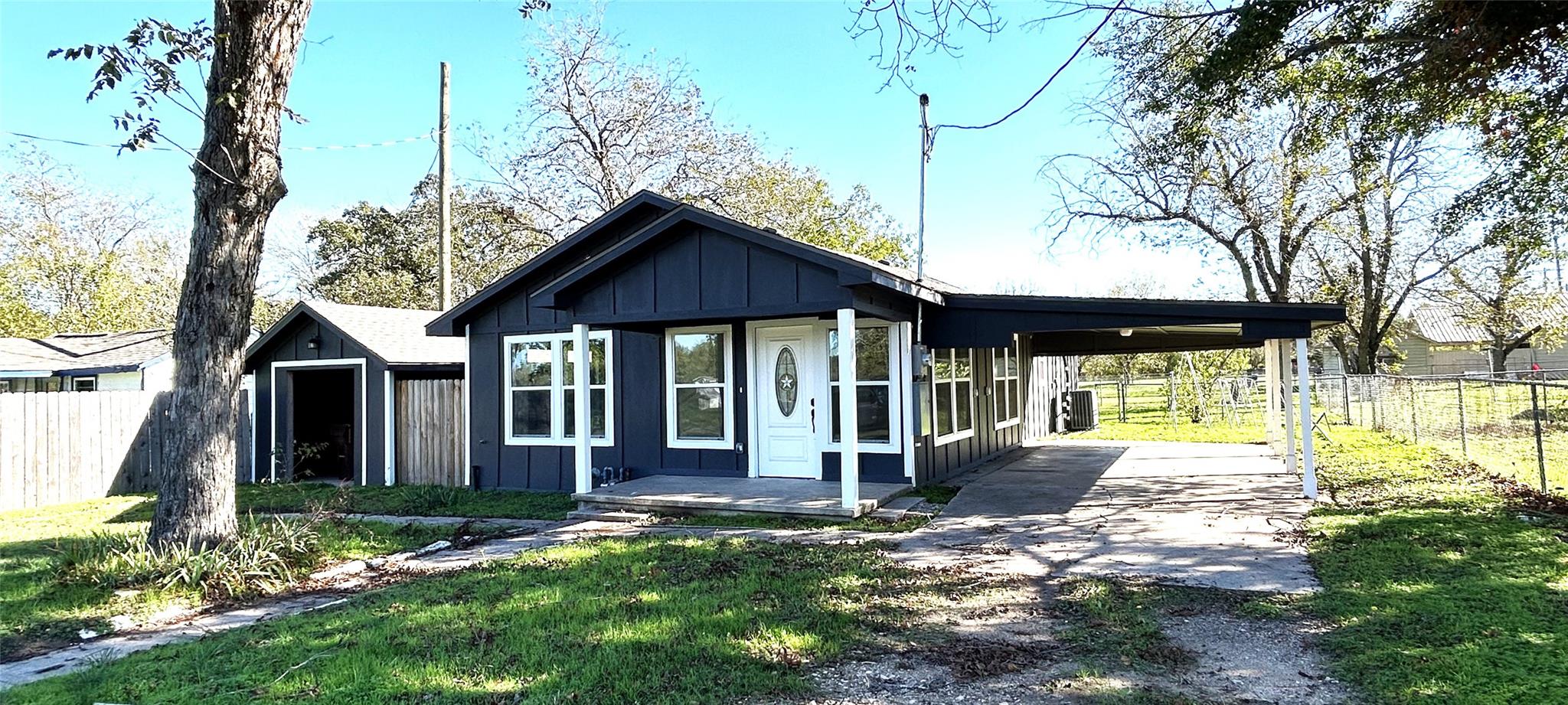 Rear view of property featuring board and batten 