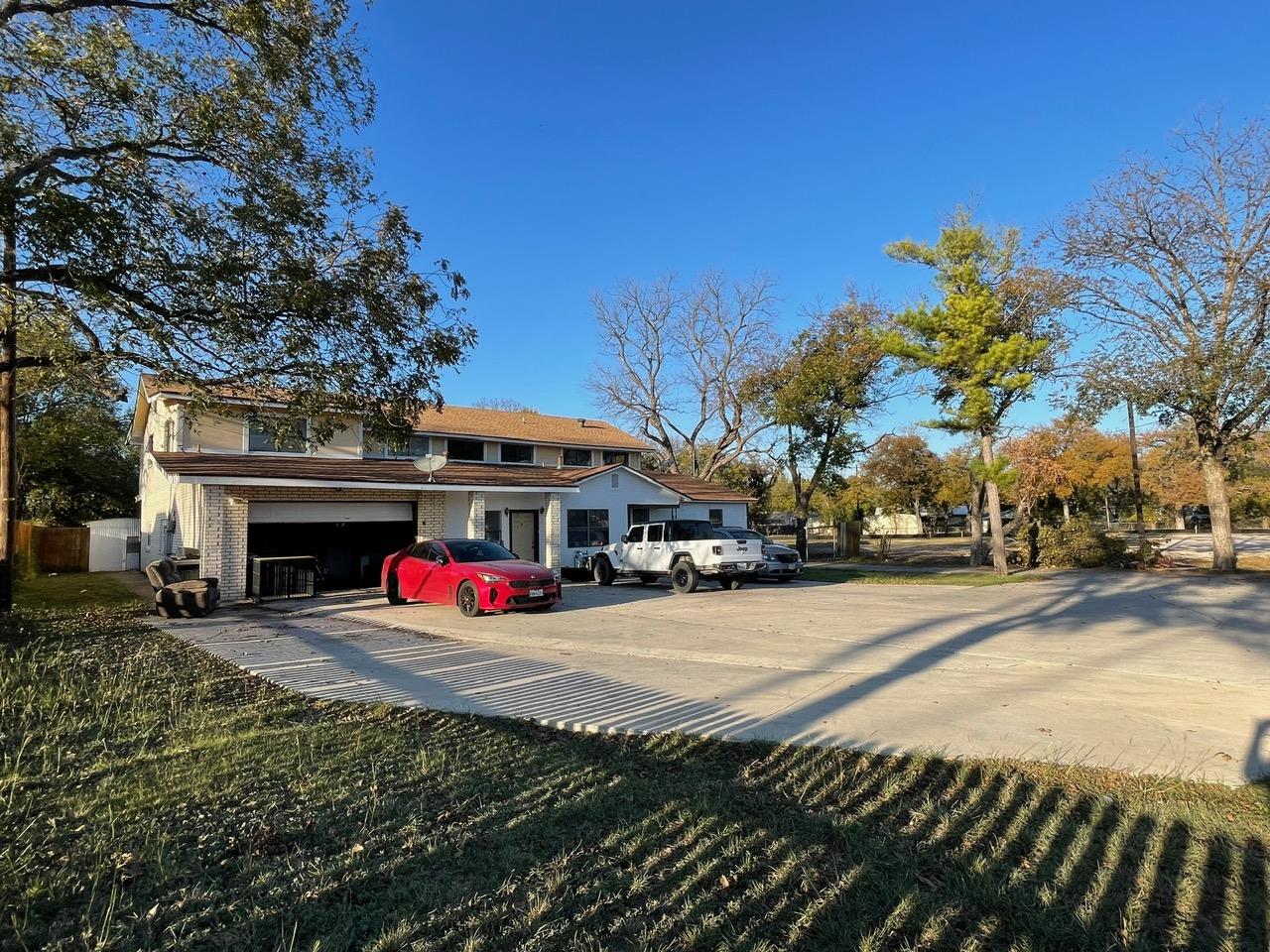 View of front of house featuring concrete drivewa