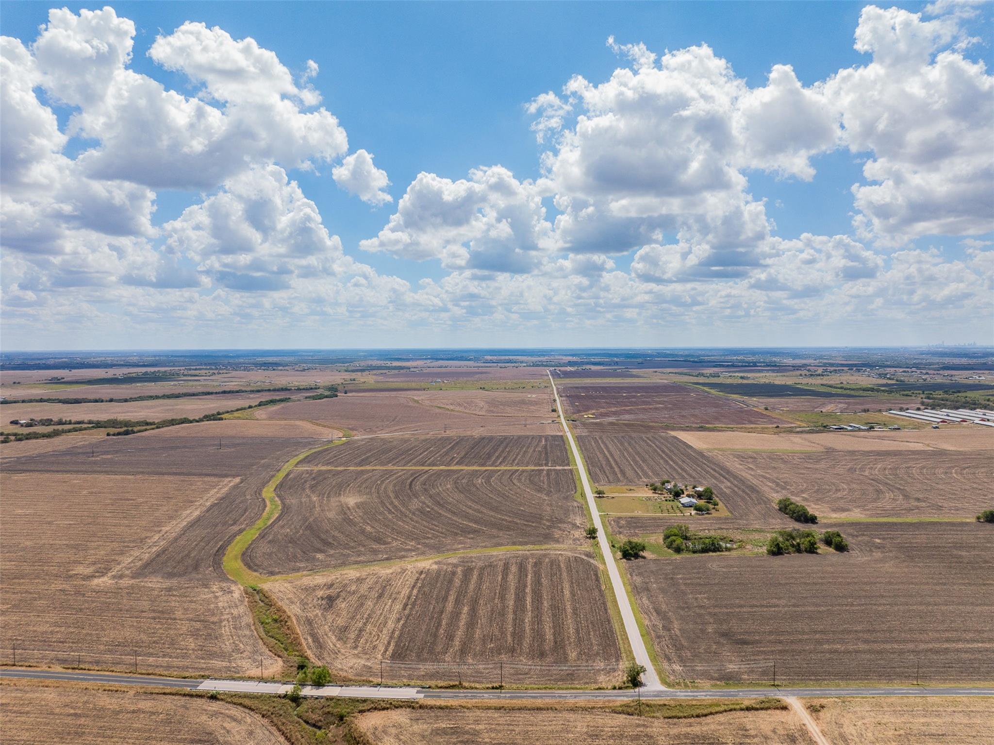 Overview of rural landscape featuring rows of cro