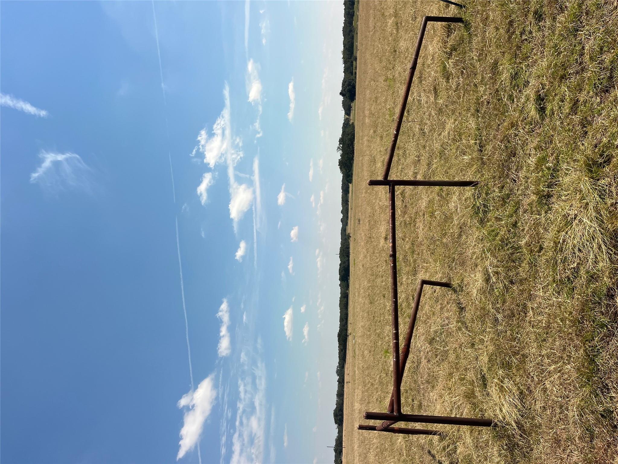 View of yard with a rural view