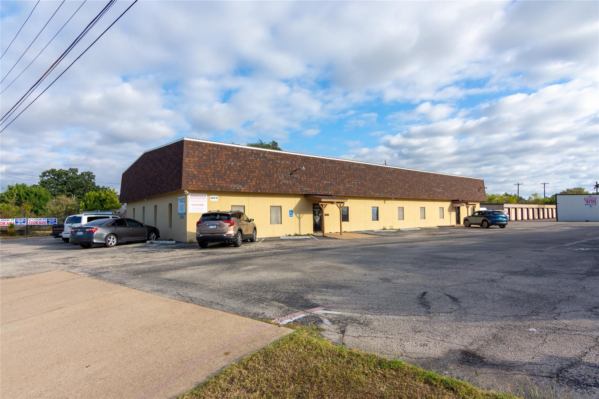 View of building exterior featuring uncovered par