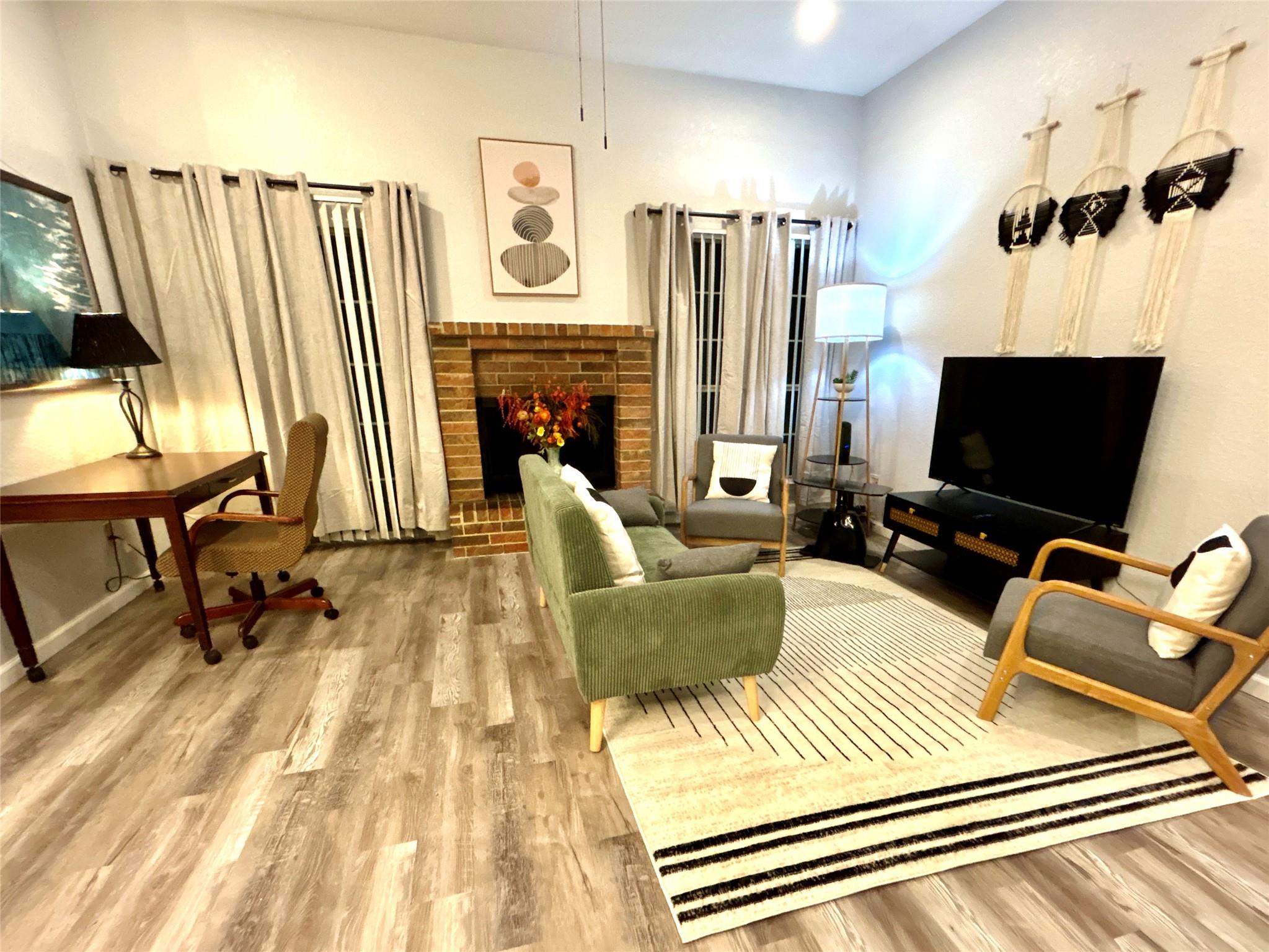 Living area featuring light wood-type flooring an