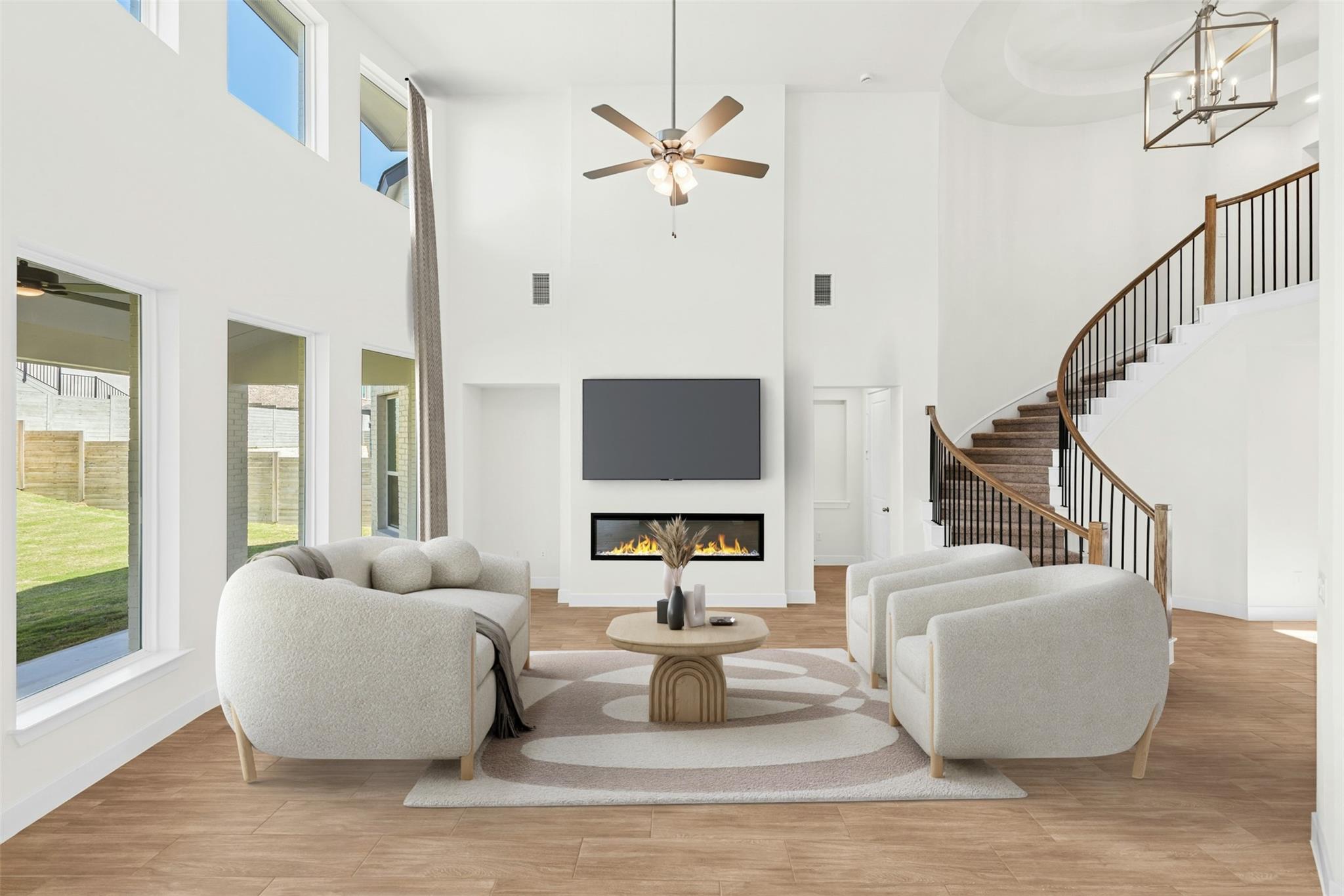 A striking fireplace accentuates the soaring doub