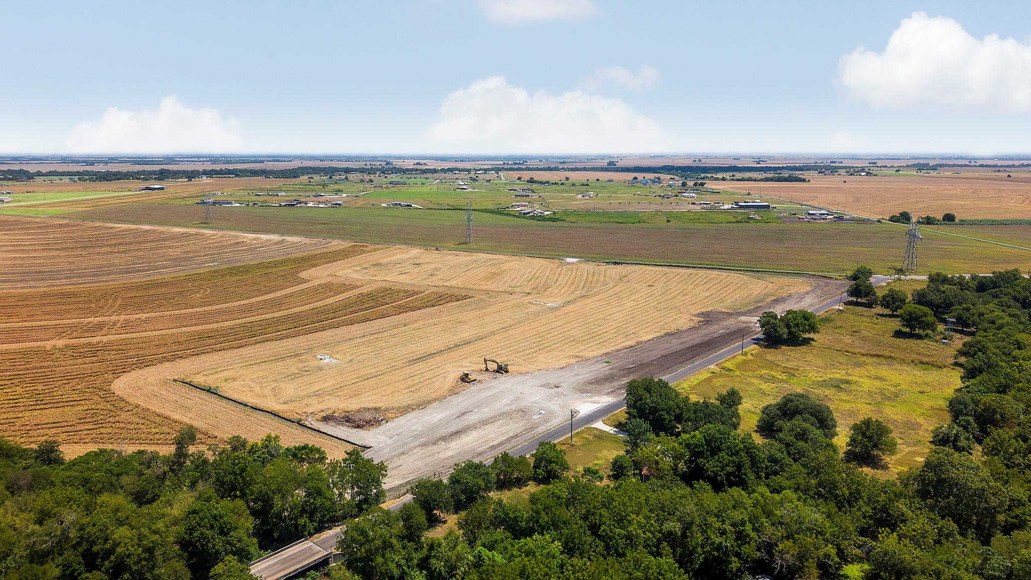 Vast open acreage stretches toward the horizon un