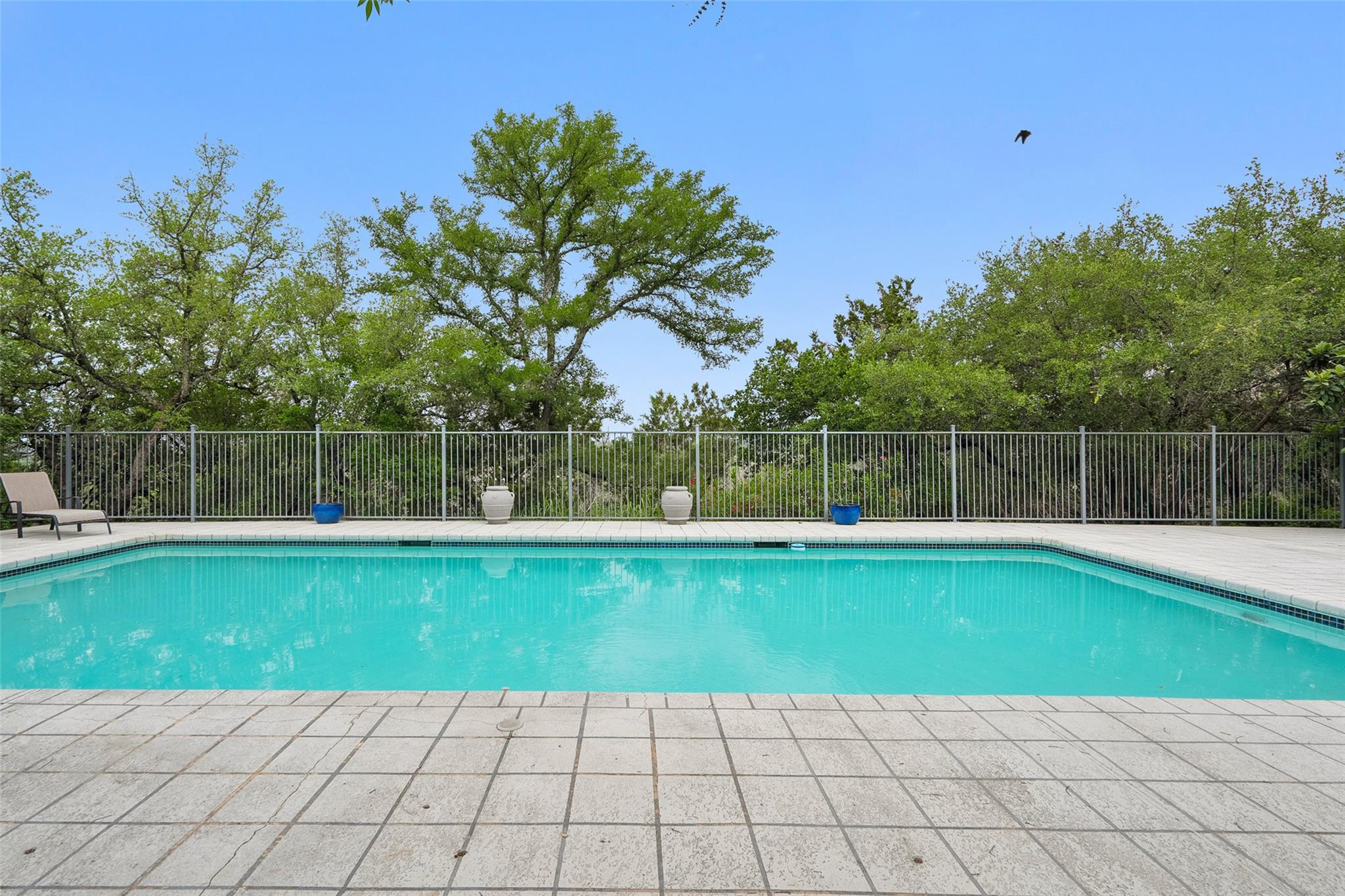 The property features an outdoor swimming pool wi