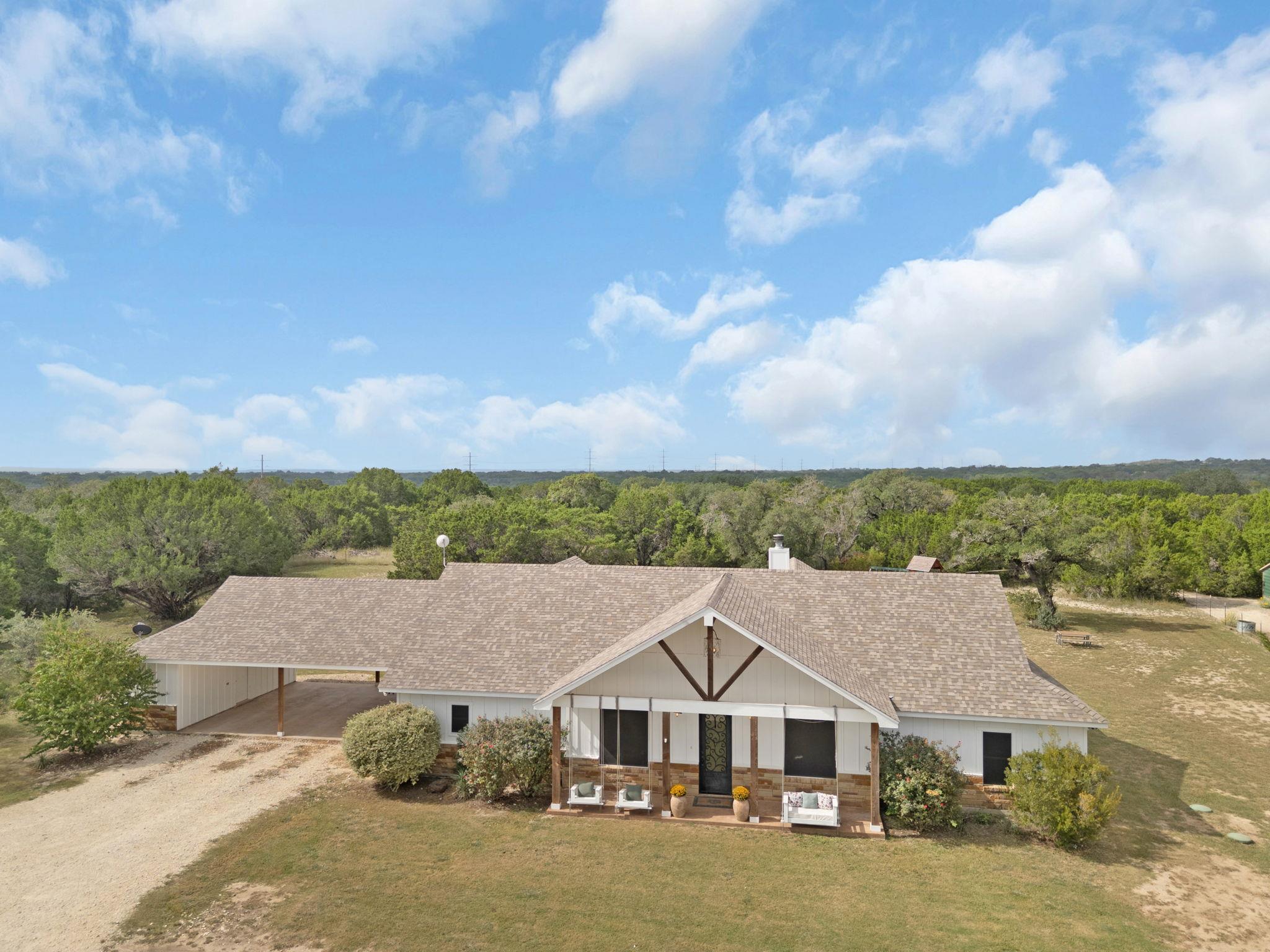 View from above of property featuring a forest