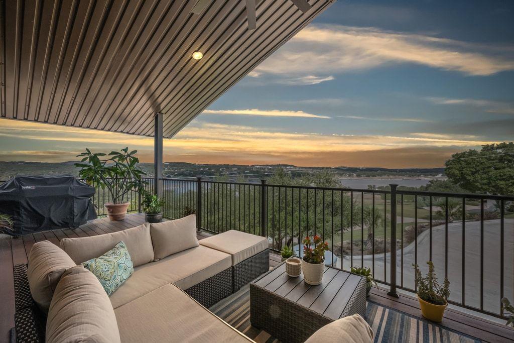 Balcony at dusk featuring an outdoor living space