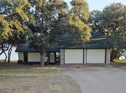 View of front of property featuring concrete driv
