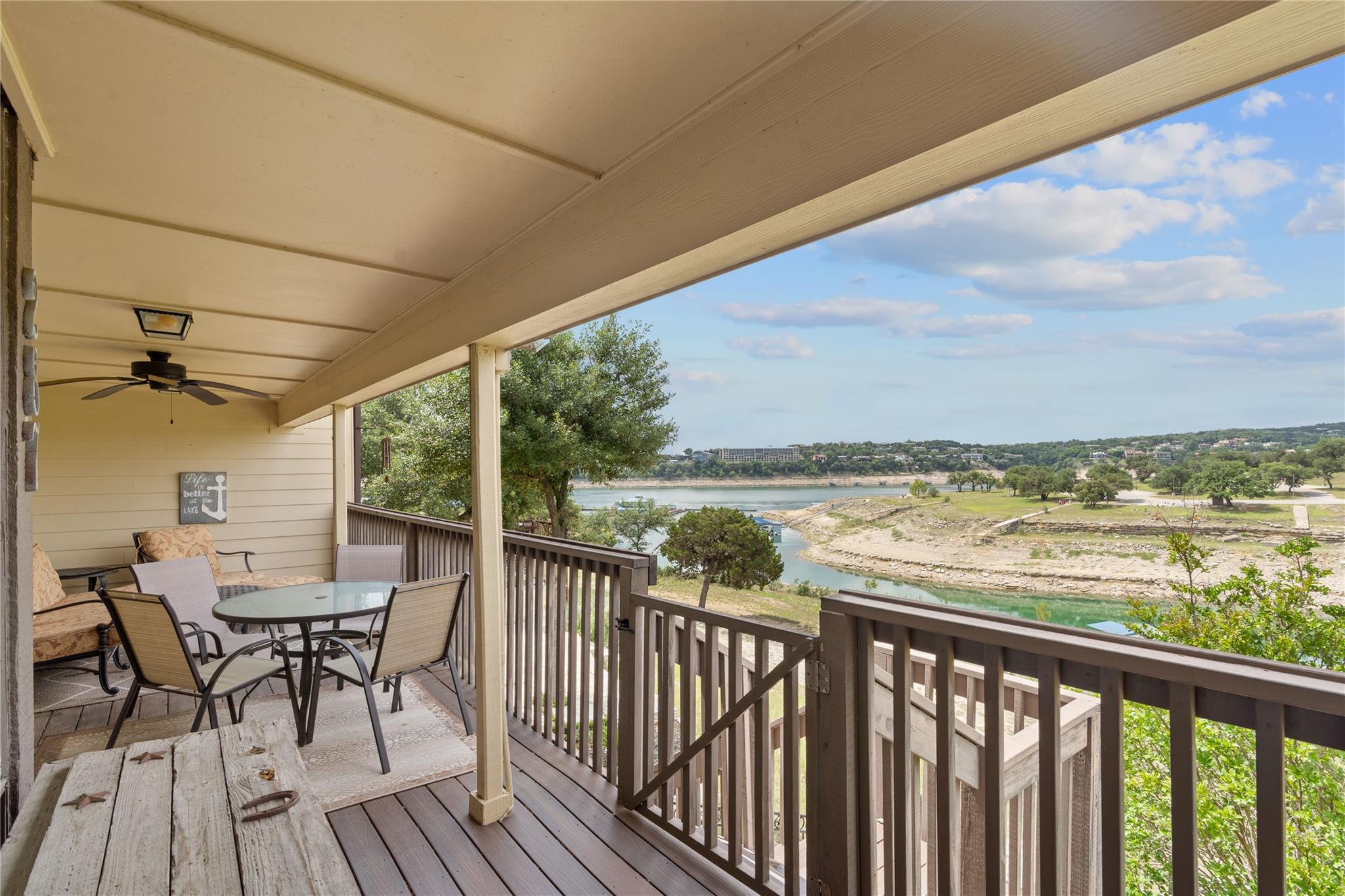 Wooden deck with outdoor dining space, a ceiling 