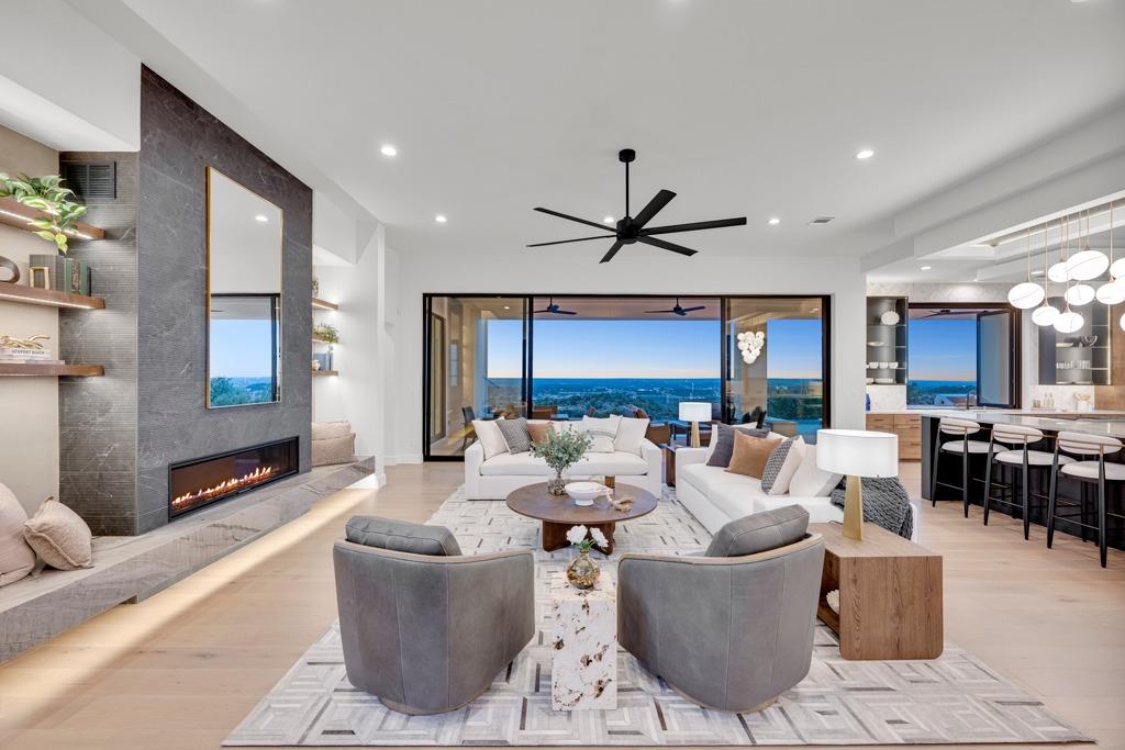 Open-concept living area featuring light wood-fin