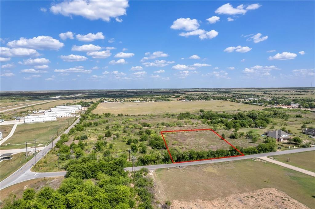 Aerial view of property and surrounding area with