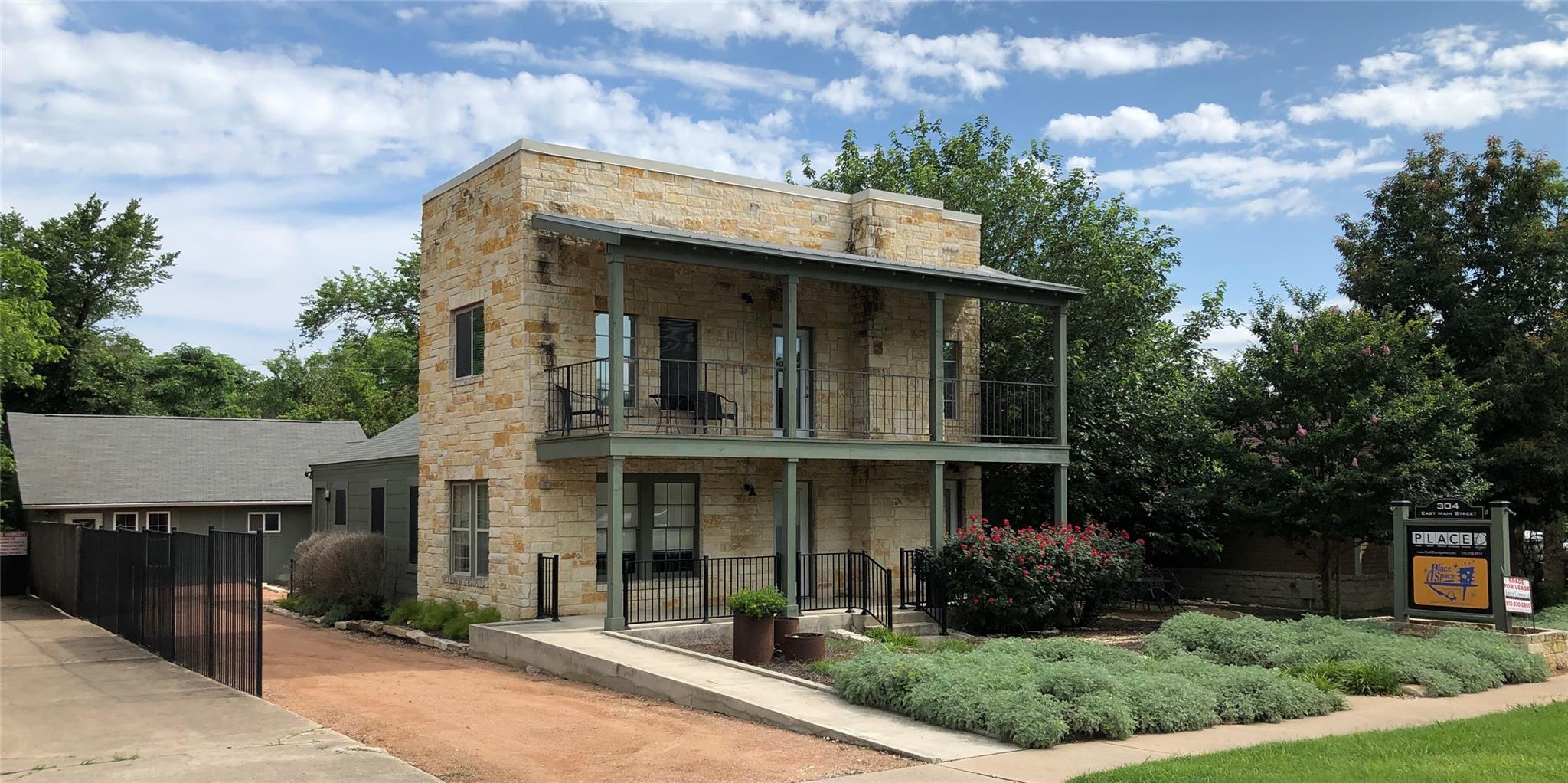 View of front of property with stone siding, cove