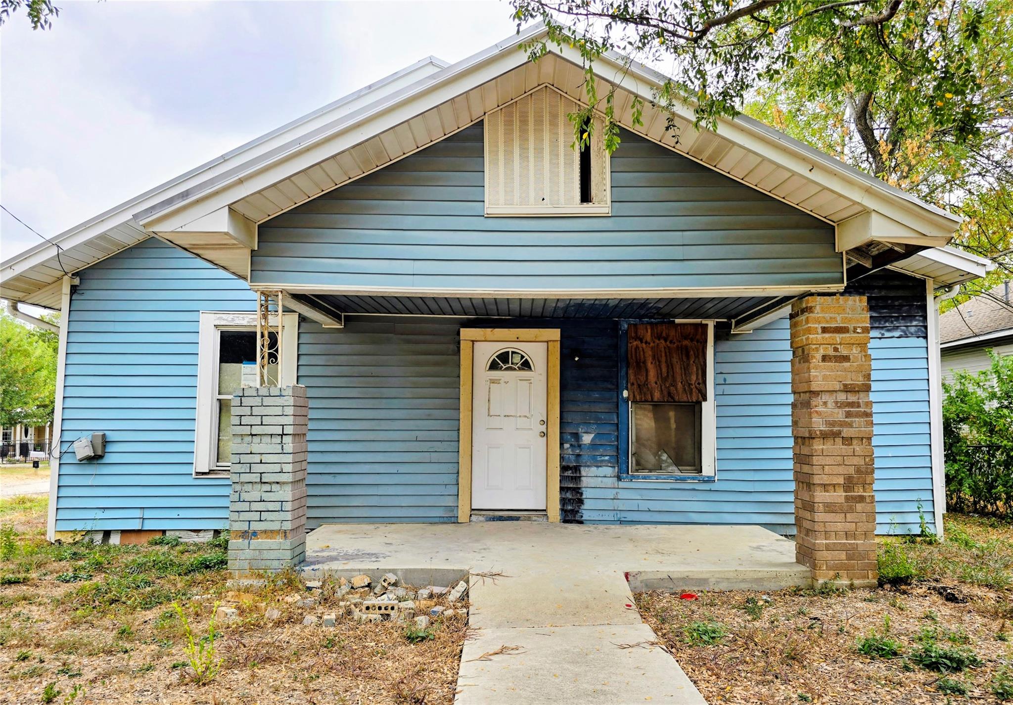 Bungalow-style home with a porch