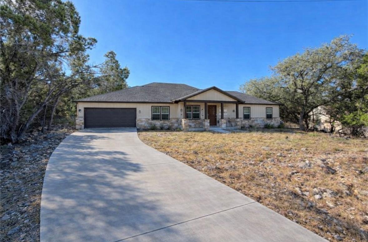 View of front of property with stone siding, cove