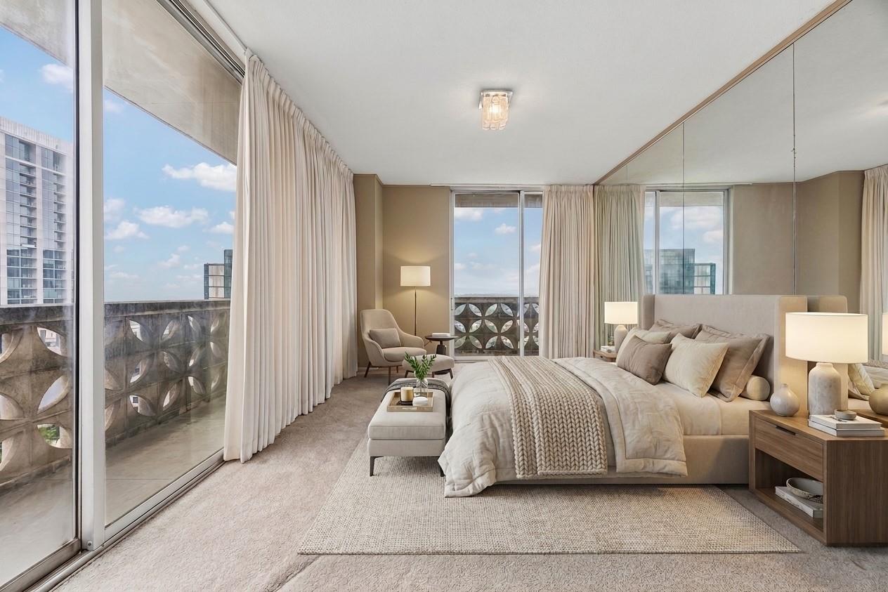 Spacious bedroom with full-wall sliding glass doo