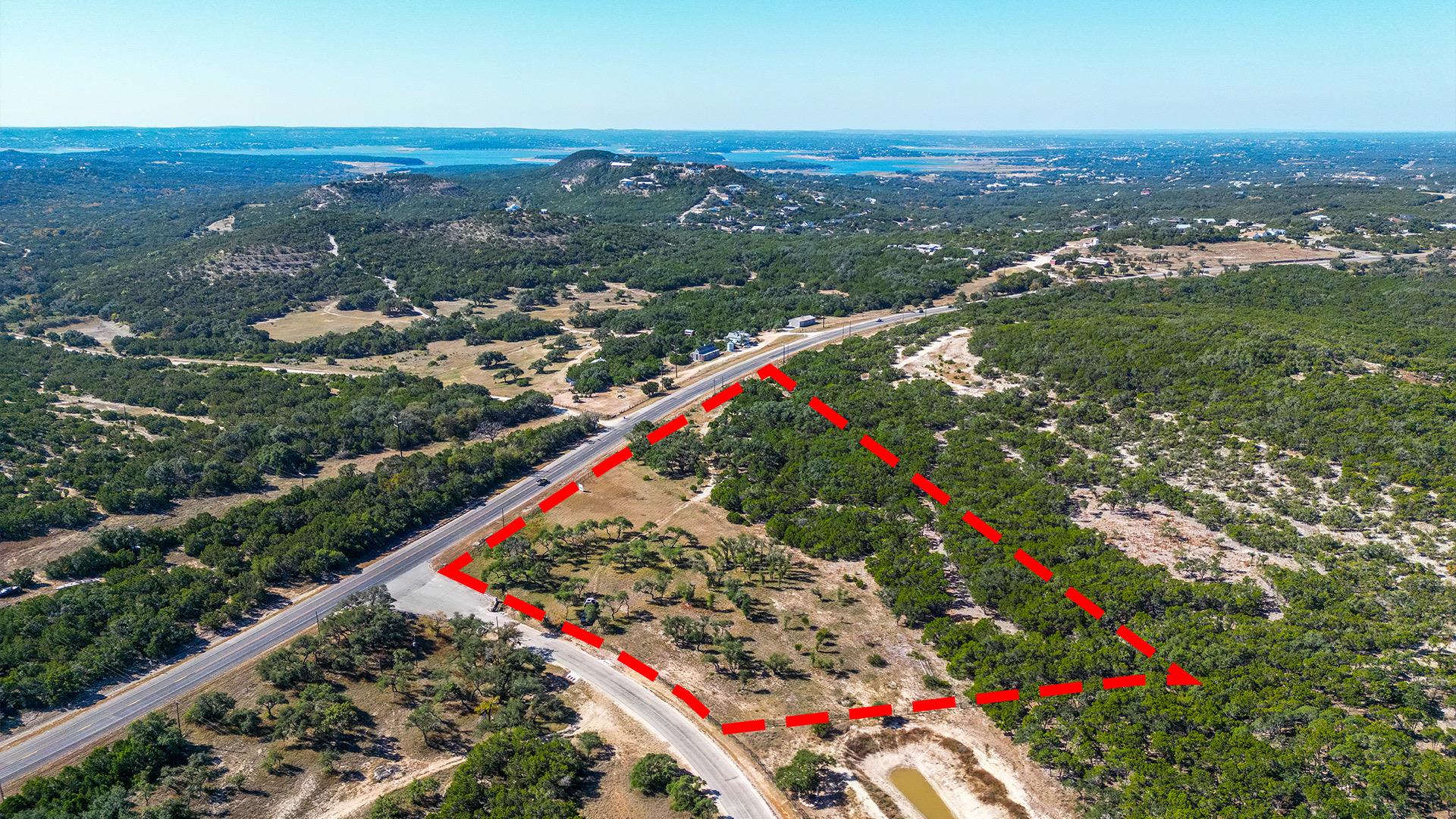 Aerial view of property and surrounding area with