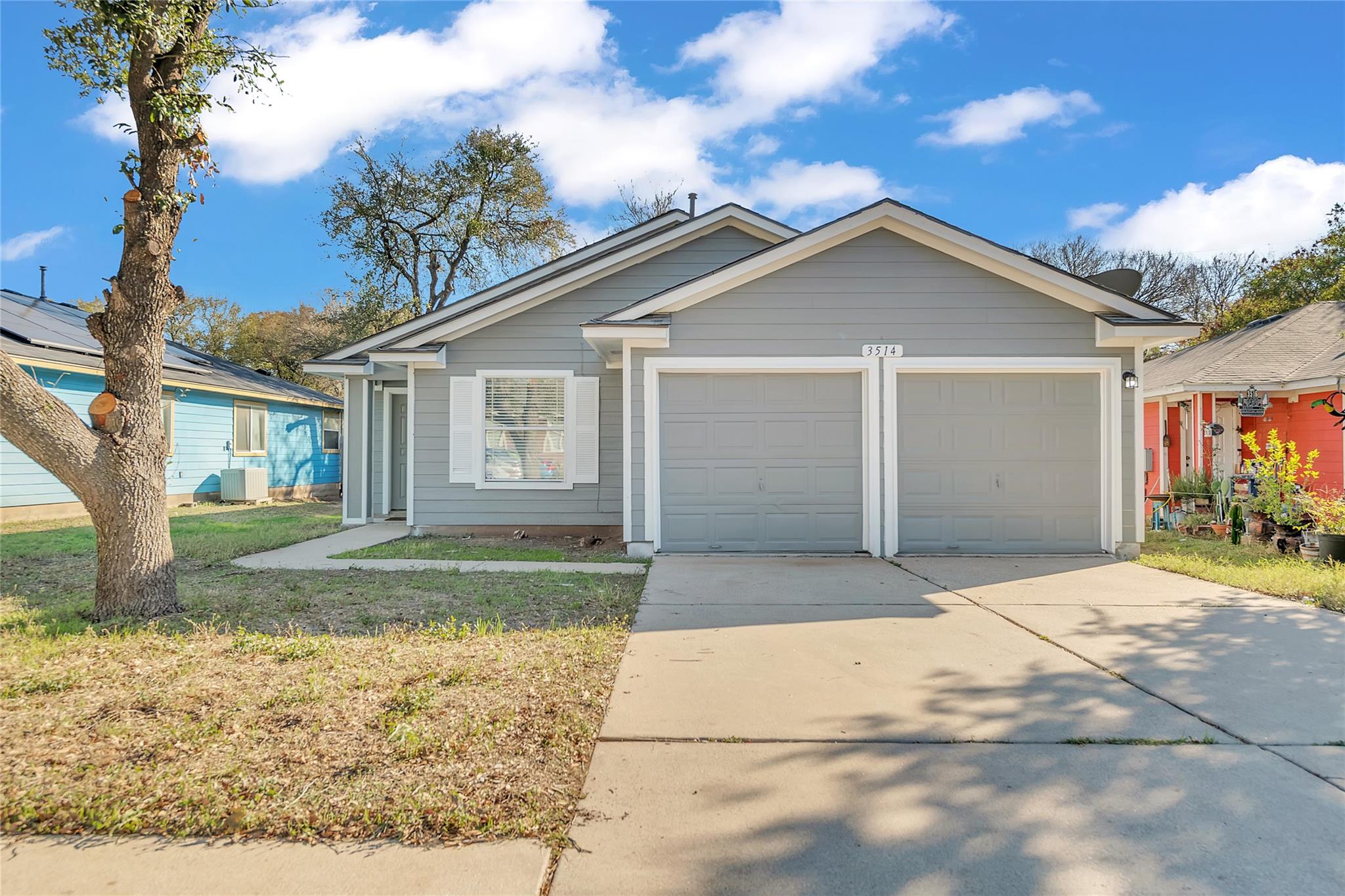 Ranch-style house featuring concrete driveway, a 