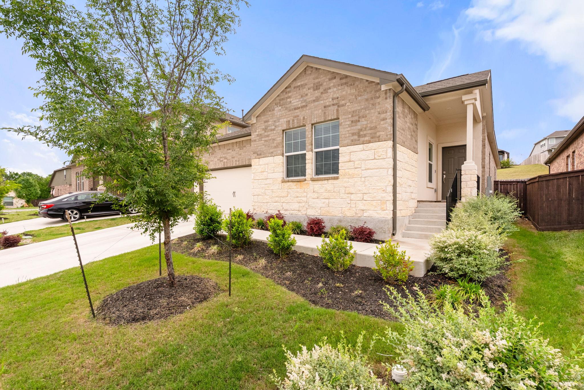 View of front of property featuring concrete driv