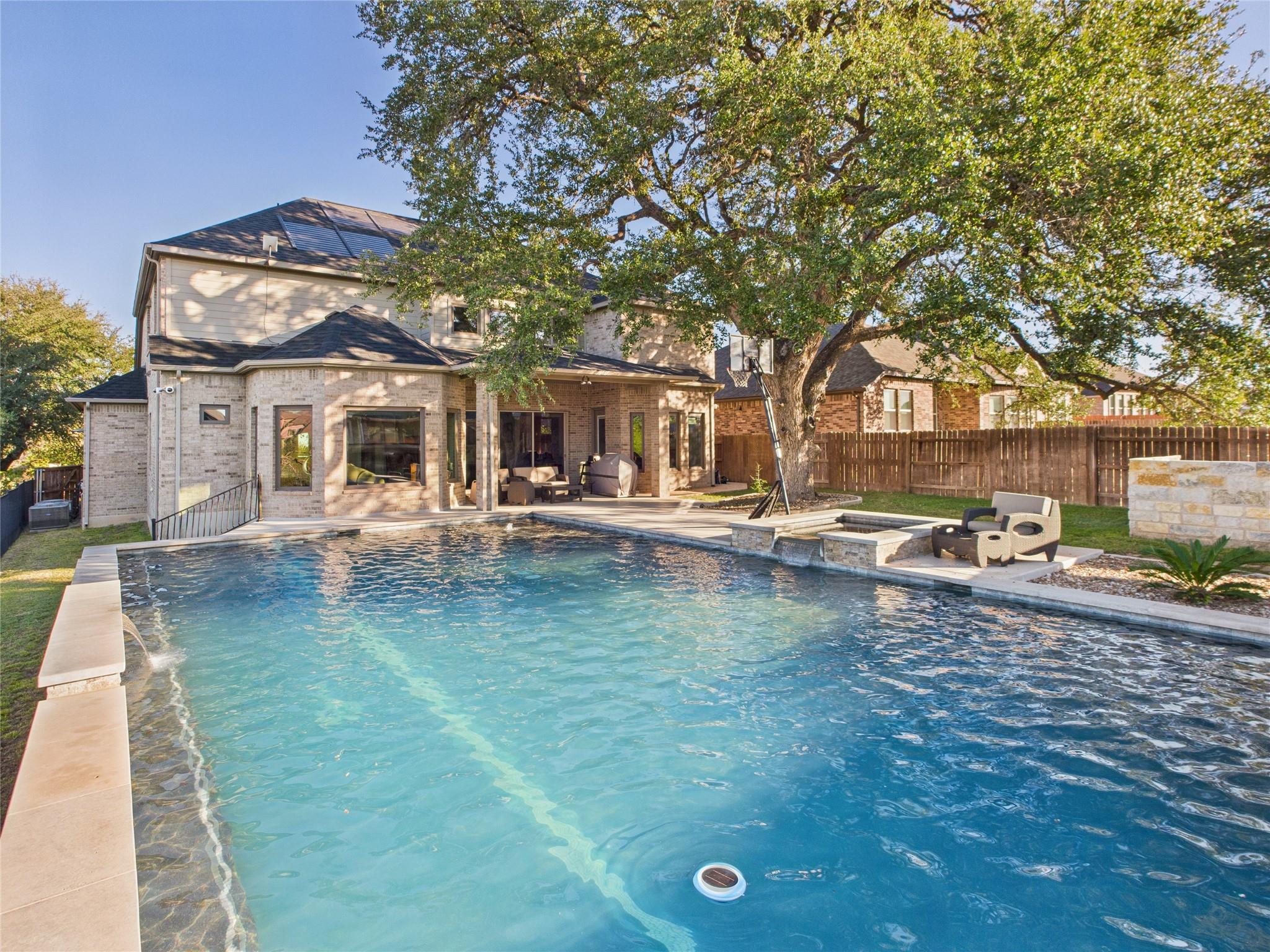 View of swimming pool featuring a fenced backyard