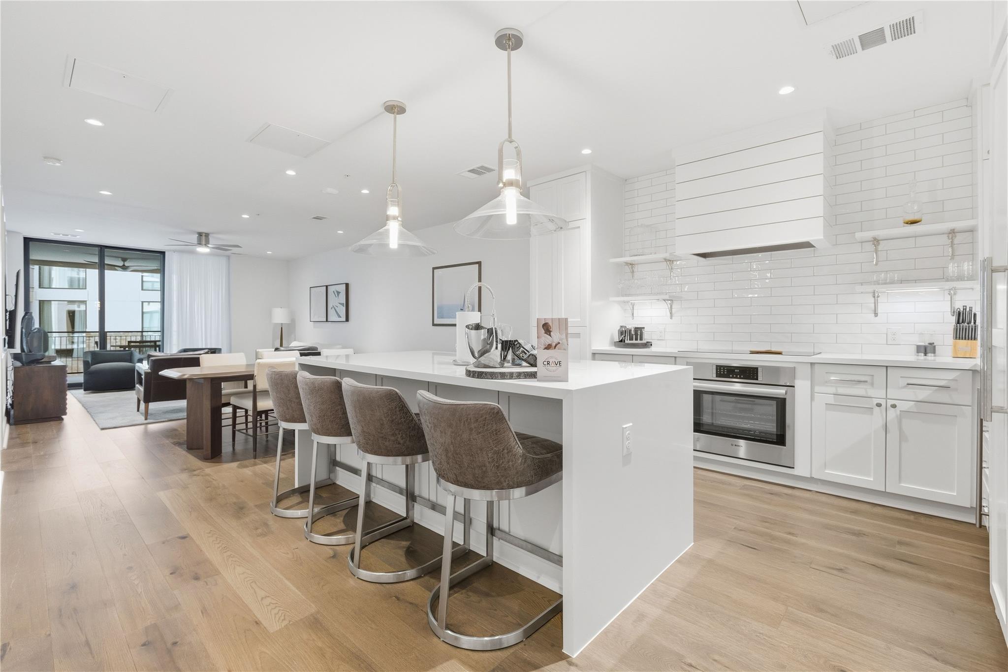 Kitchen with white cabinets, decorative light fix
