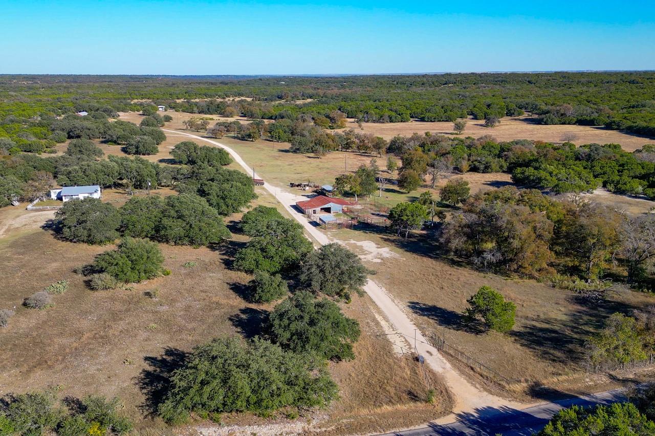 View of property location featuring a forest