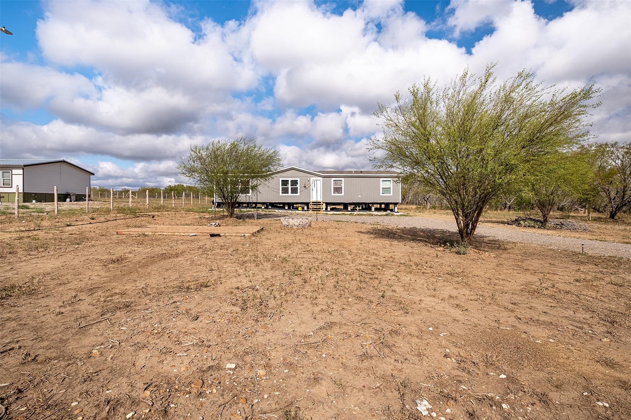 Back of property with a view of countryside