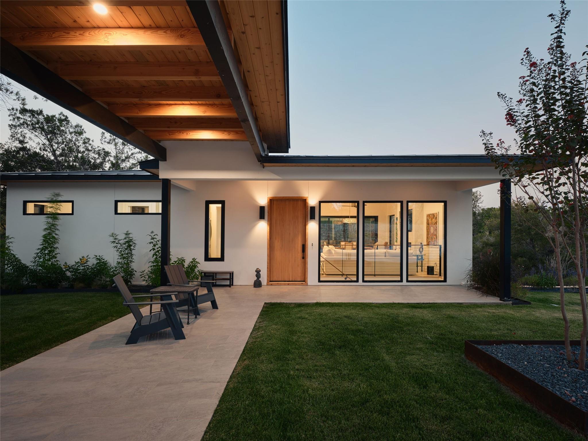 Back of property featuring a patio area, a yard, 