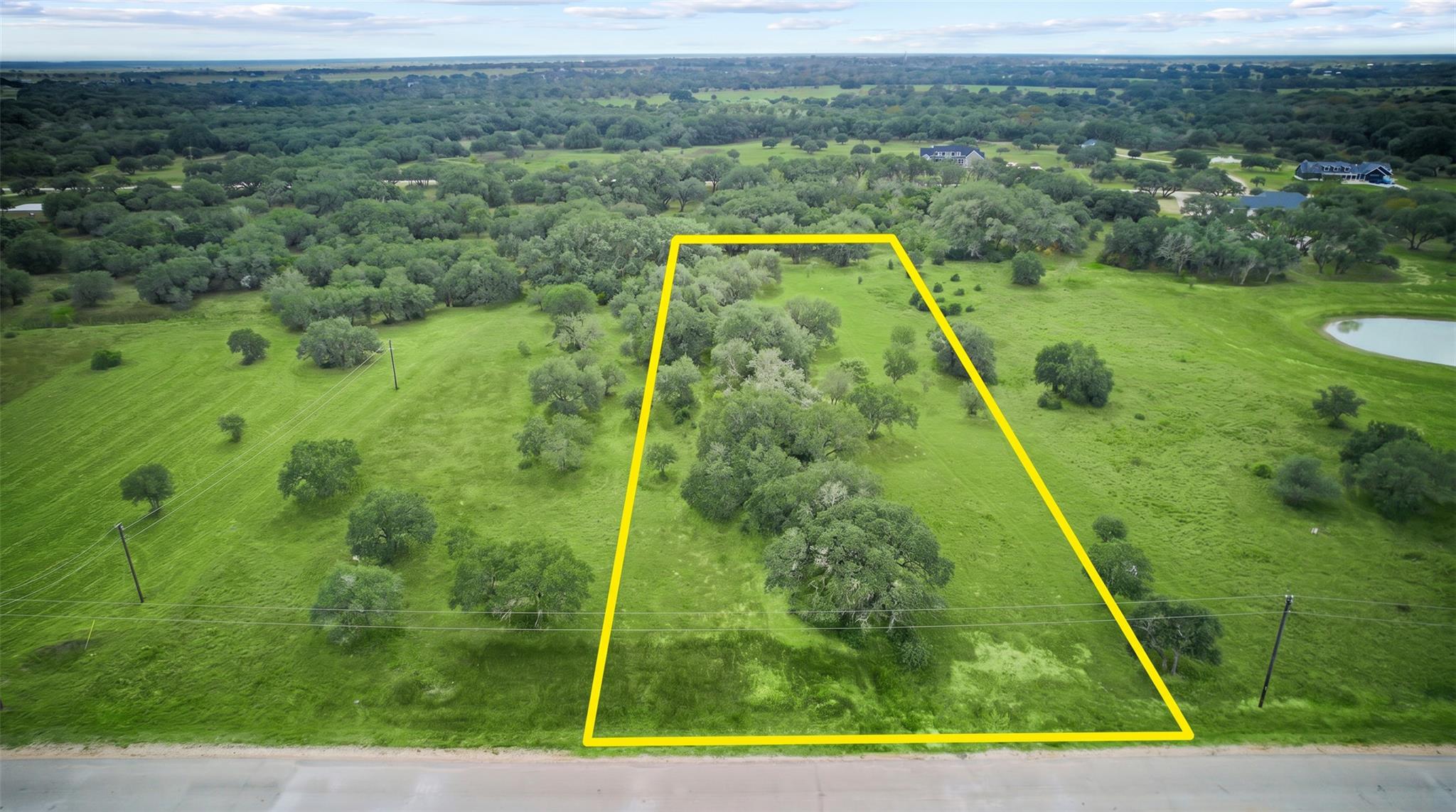 Discover a spacious lot enveloped by verdant tree