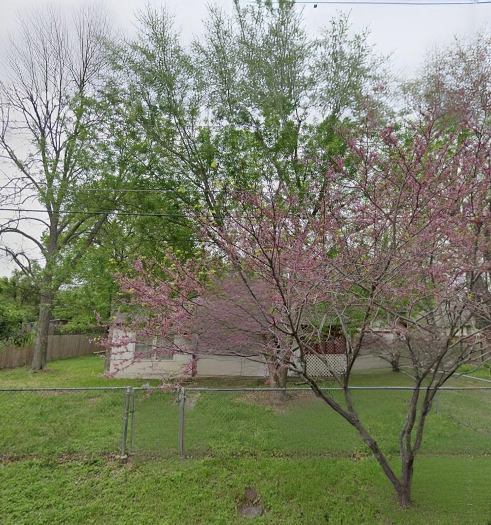 View of yard with a gate
