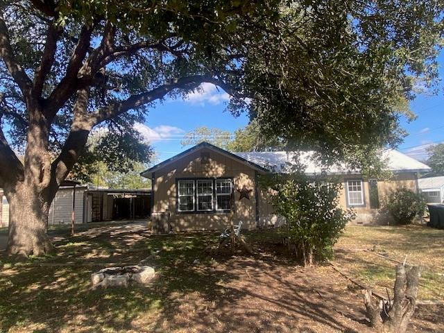 View of front of property with a front lawn