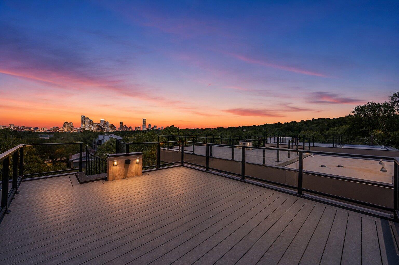 City skyline views from a rooftop deck, offering 