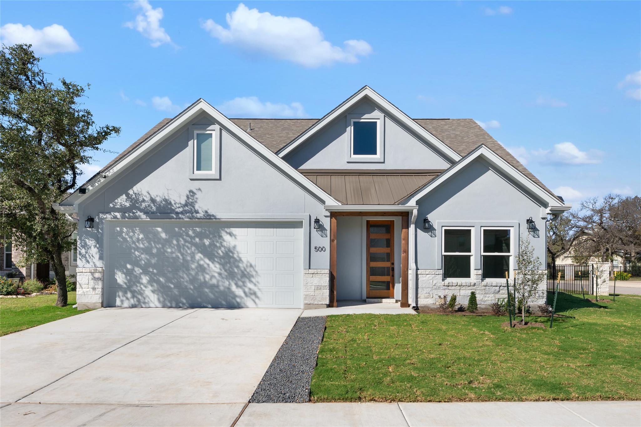 View of front of home with a standing seam roof, 
