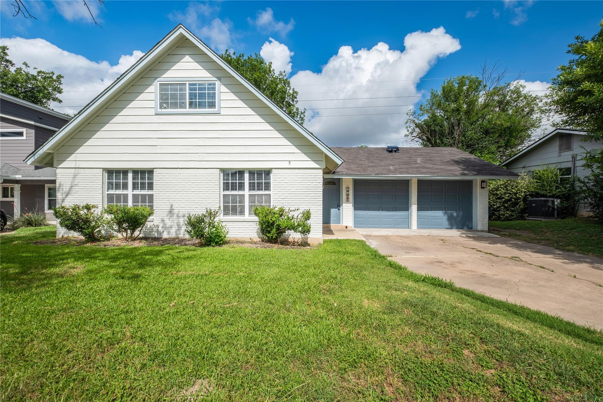 A classic facade with a prominent gabled roof and