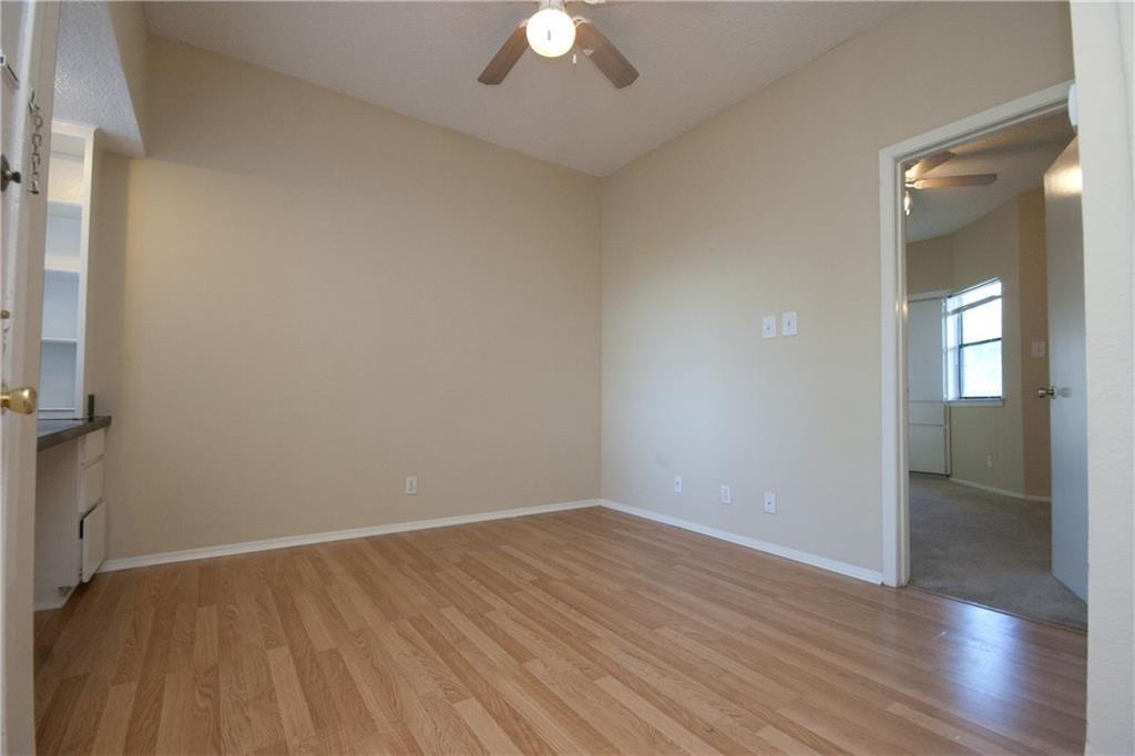 Spare room with ceiling fan and light wood-style 