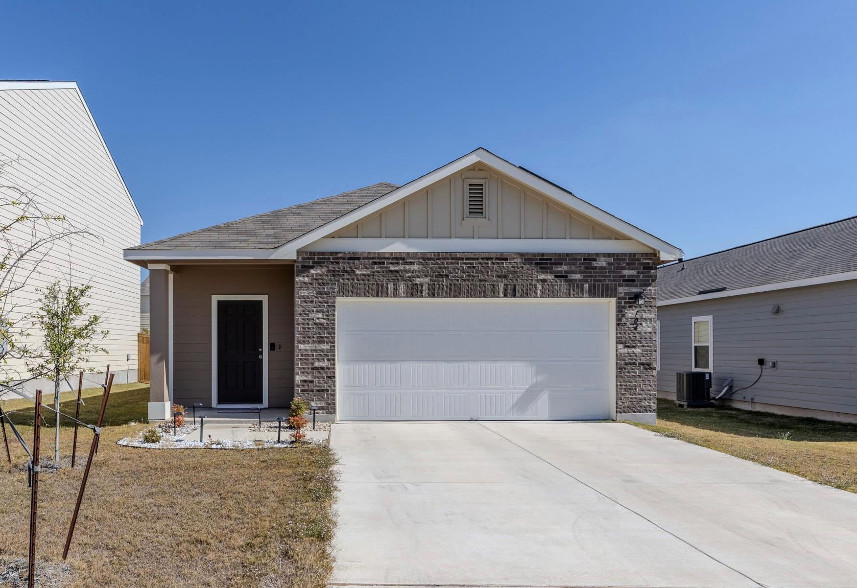 Single story home with board and batten siding, b