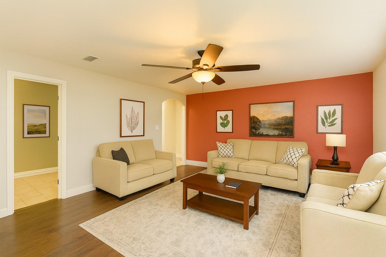 Living area featuring arched walkways, wood finis