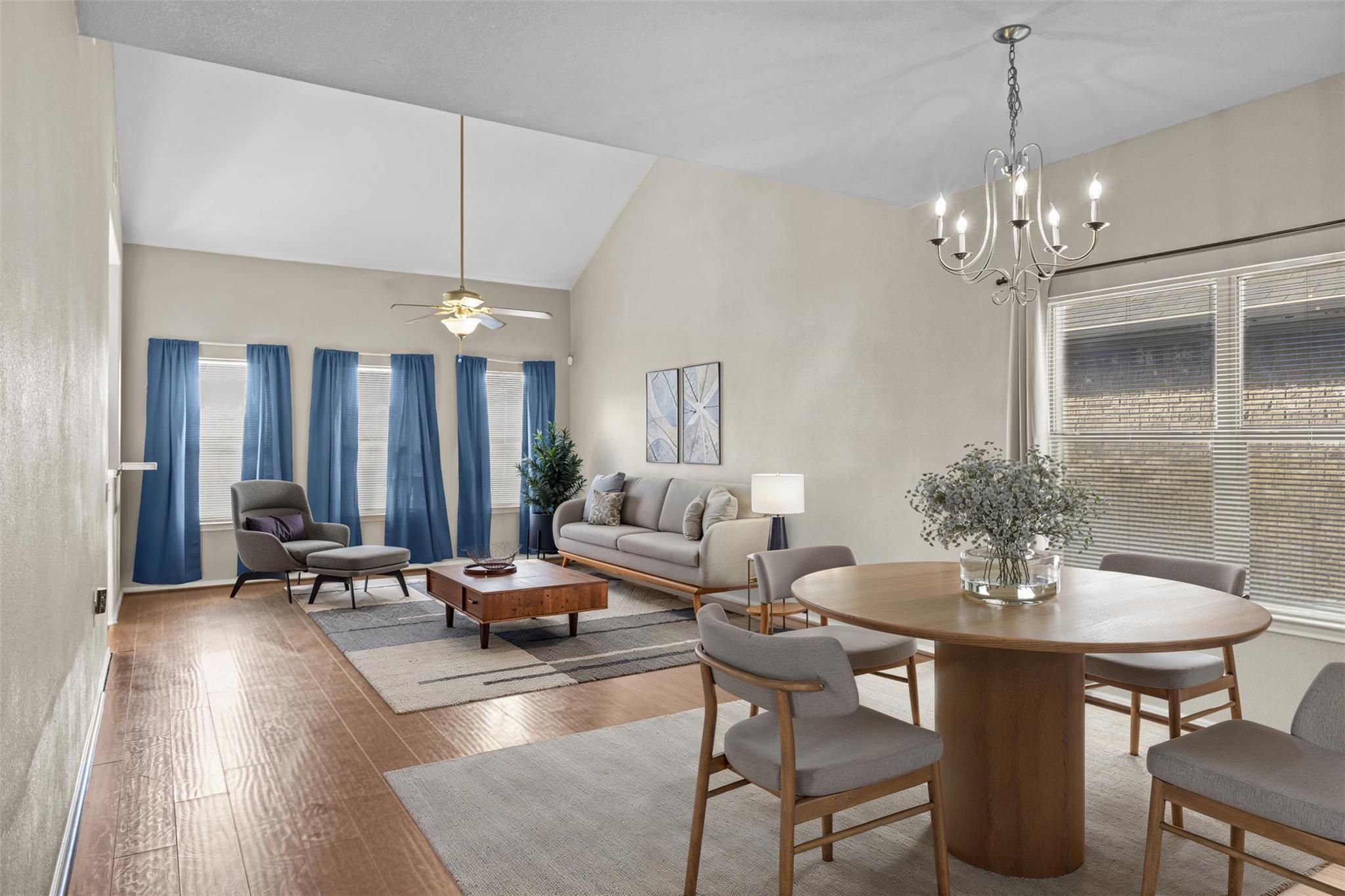 Dining space with vaulted ceiling, hardwood / woo