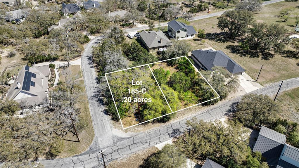 Aerial view of residential area with property par