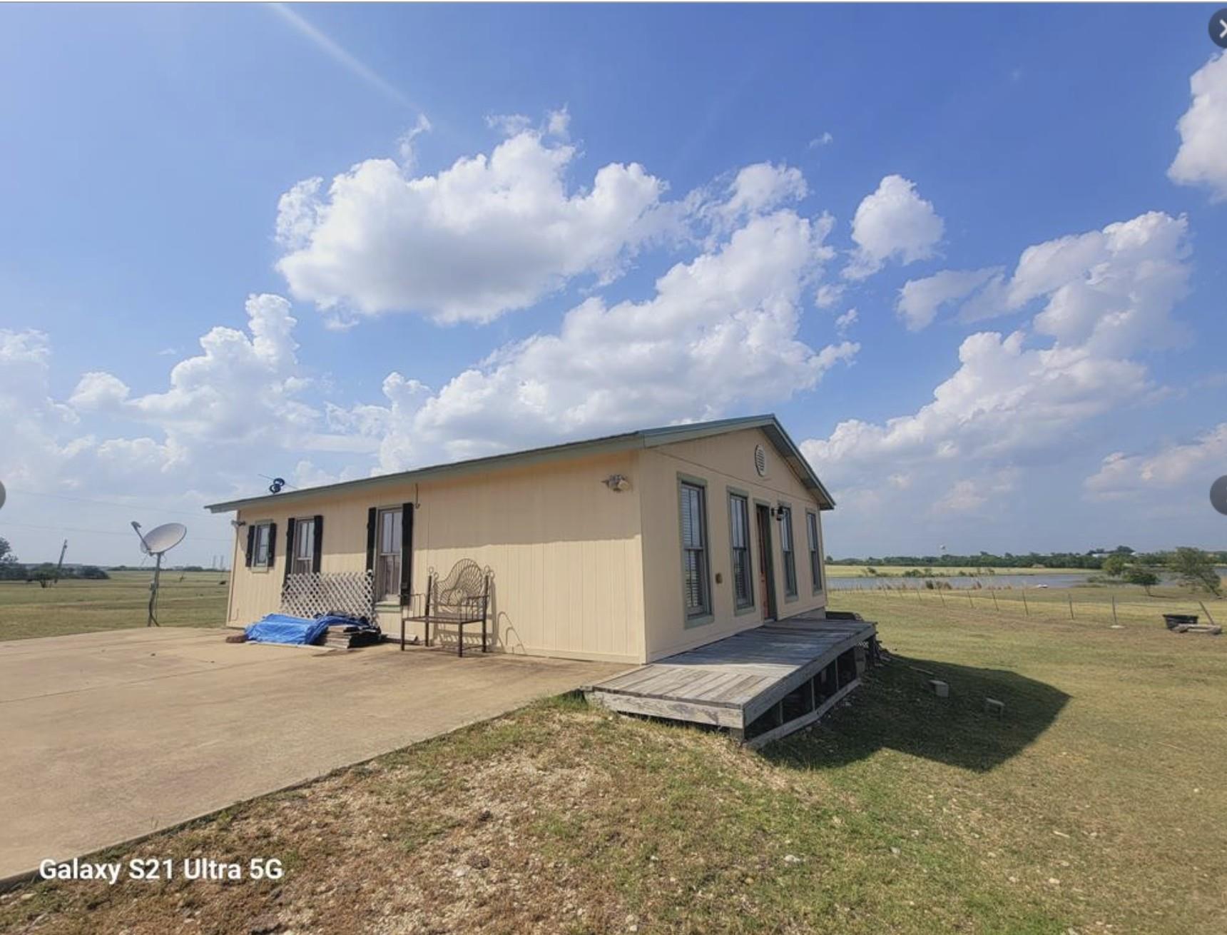 Rear view of property with a deck
